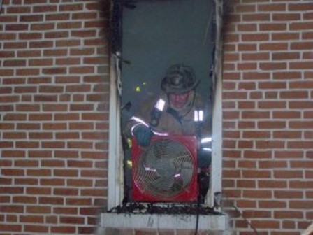 FF Stackhouse ventilates during the Helen St. fire.